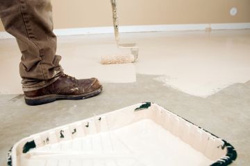 Painter painting garage floor in Cranberry Township